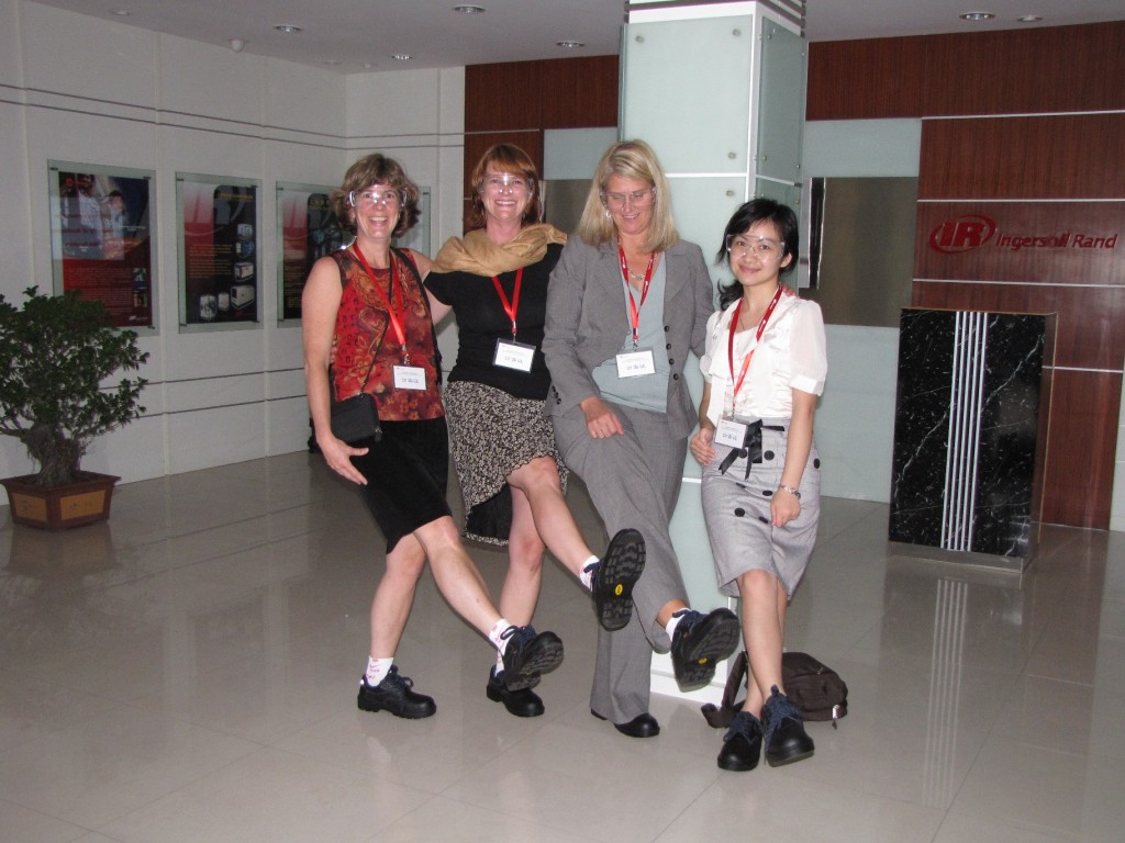 Foster School alumni James Li organized a visit to the Ingersoll-Rand air compressor plant for us, complete with industrial footgear for the ladies.  From left to right, Jennifer Koski, Krista Peterson, Jane Reynolds, and one of our IR hosts, Grace.