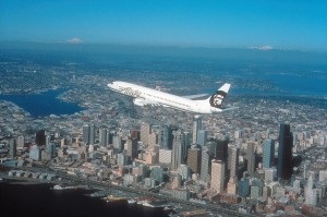 Alaska Airlines plane flying over Seattle