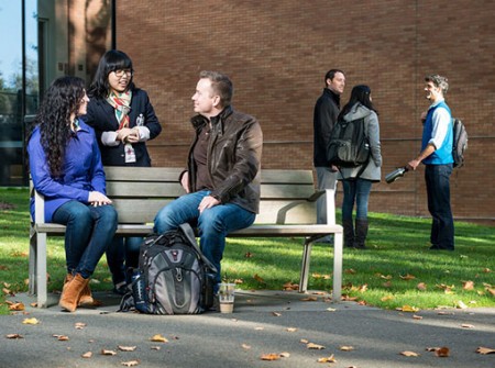 Students talking to each other outside of PACCAR Hall 