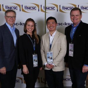 Abby Carlson and Scott Lee, with coaches Rick Carter and Jeff Lehman at the National Collegiate Sales Competition
