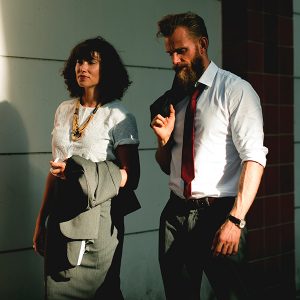 Business coworkers walking, conveying a sense of humility