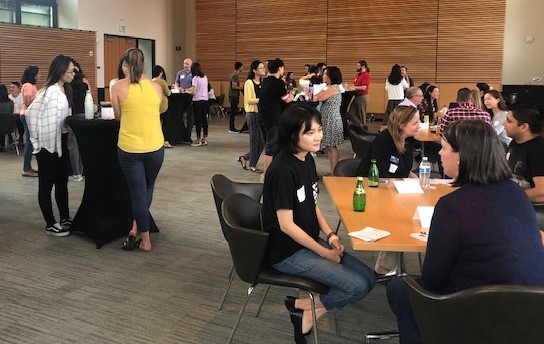 Foster graduate students participate in a mock networking event to practice their relationship building skills. It is set up by UW Foster School of Business Career Services