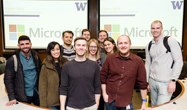 Microsoft employees interact with MBA students