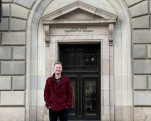 Wil Engstrom (MSBA Class of 2021) in front U.S. Department of Commerce building.