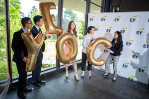 yeoc graduates holding balloons spelling the acronym YEOC