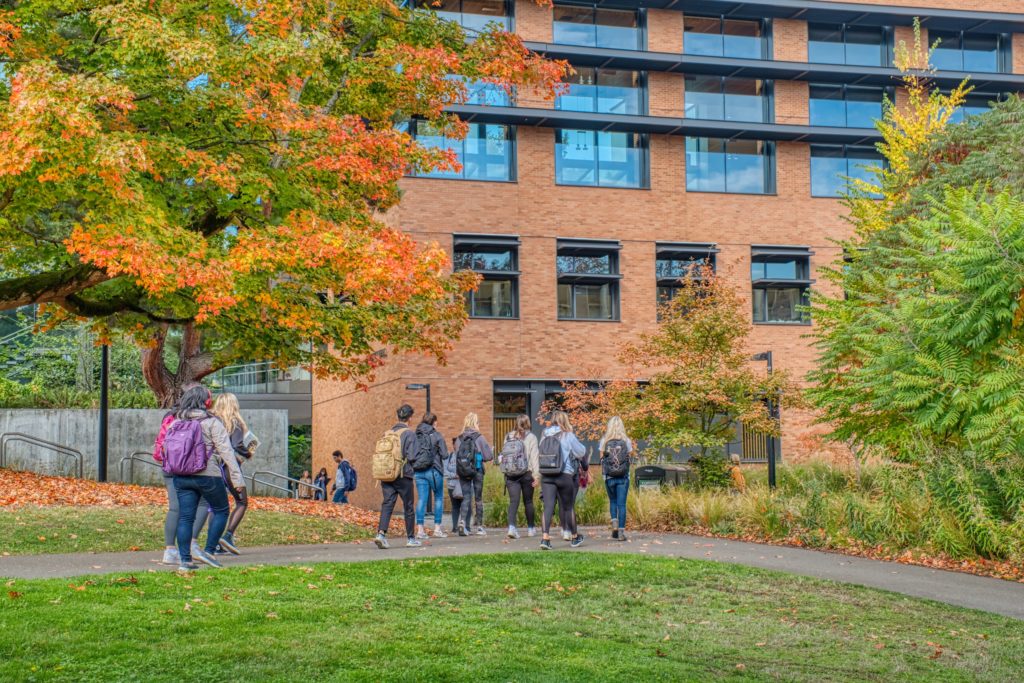 students walking in front of foster's dempsey hall