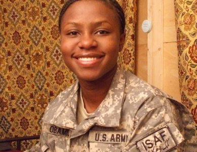 Smiling woman wearing US Army uniform.