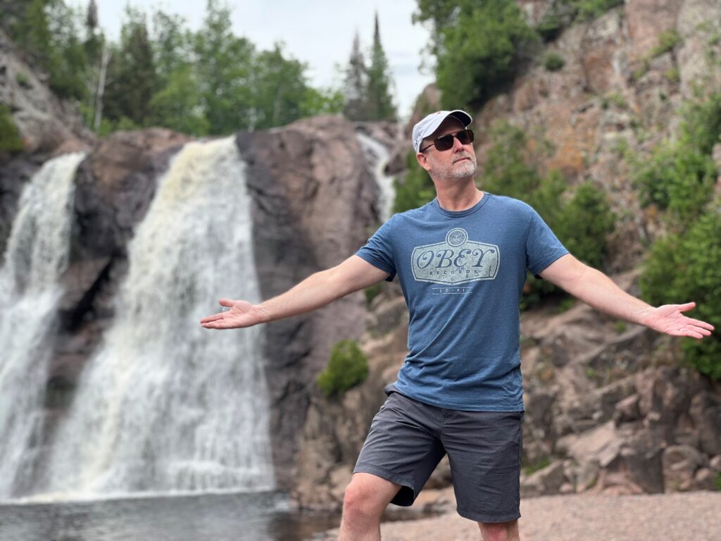 Mark next to a waterfall