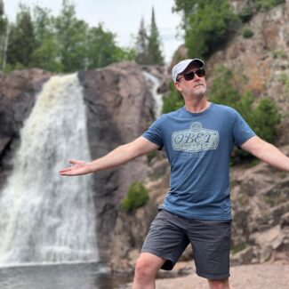 Mark next to a waterfall