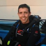 Andrew aboard a dive boat in Honduras. He's been a diver since 2000.