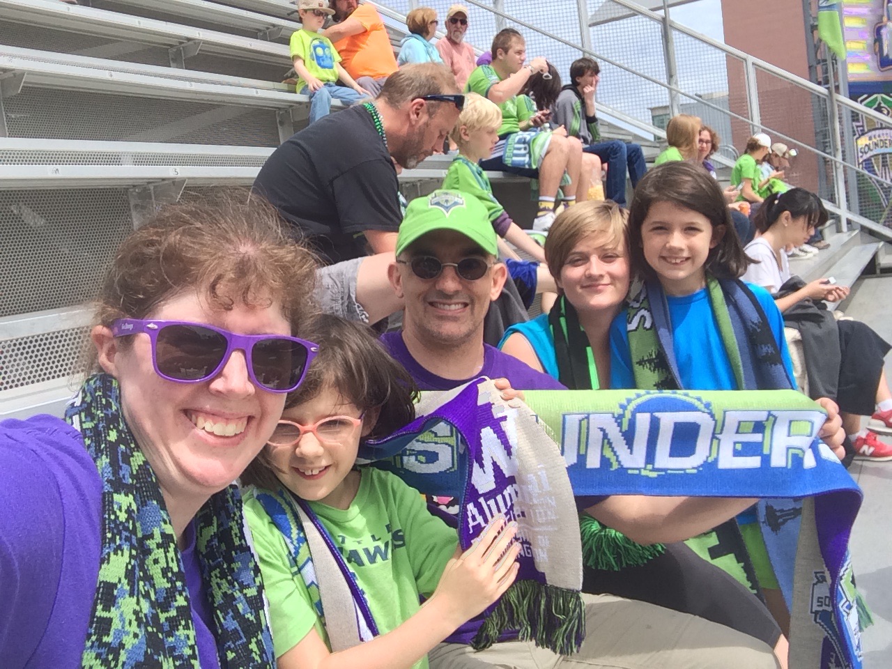 Libby with her family on UW day at the Sounders.
